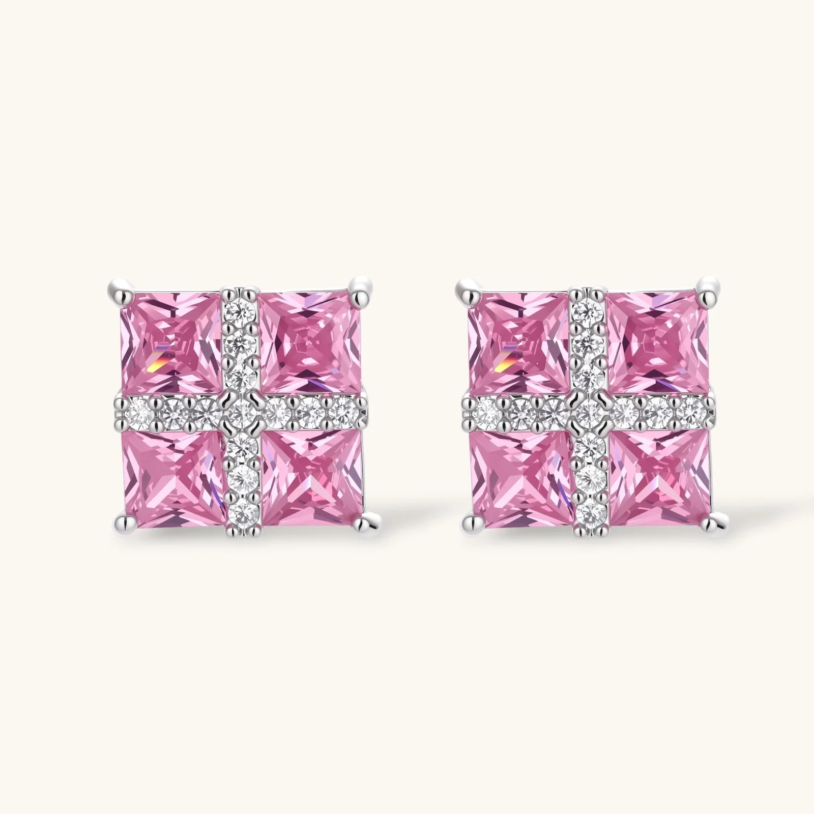 White gold plated jewelry set with pink cubic zirconia stones in geometric cross design, featuring Y-necklace and square stud earrings