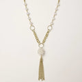 Long gold-plated necklace with freshwater pearls, chunky chain links, and flowing tassel pendant
